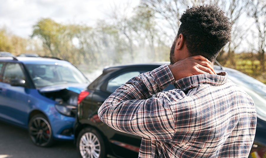 mildly hurt man in front of car crash